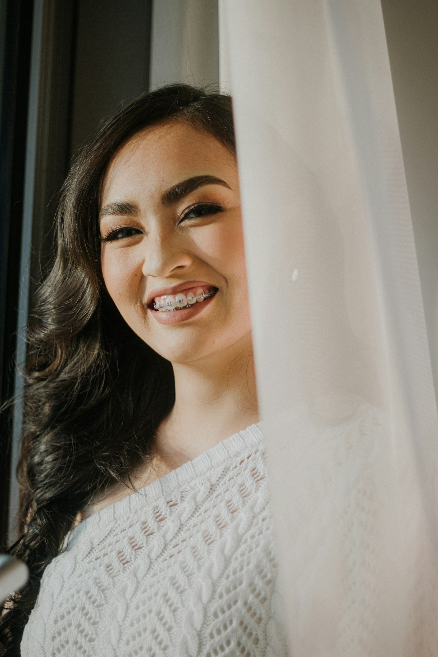 Smiling woman wearing braces